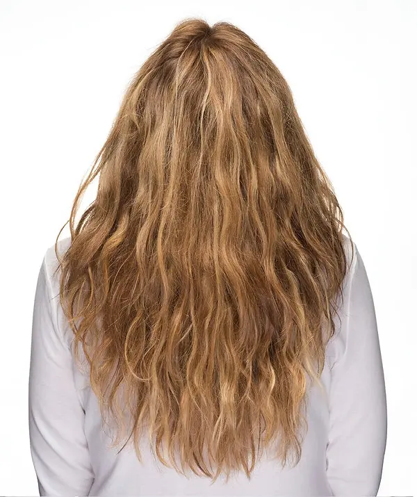 Long, wavy hair with a warm blonde hue, showcasing the hair's natural texture, ideal